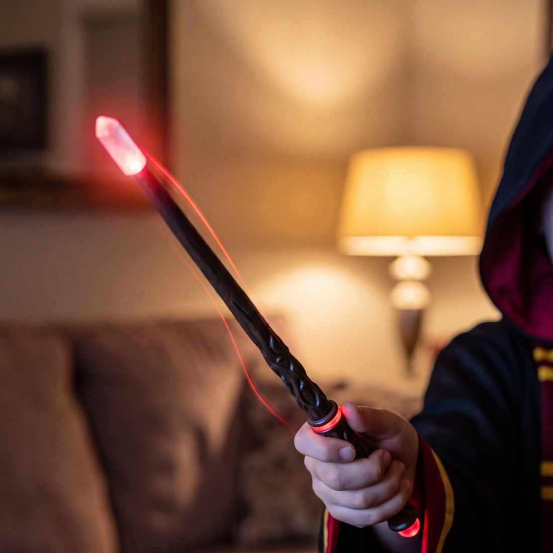 Casting a spell with the red wand, crystal tip glowing